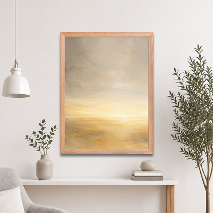 Framed sunrise poster featuring a glowing ocean horizon with soft watercolor textures in warm gold, ivory, and neutral tones.